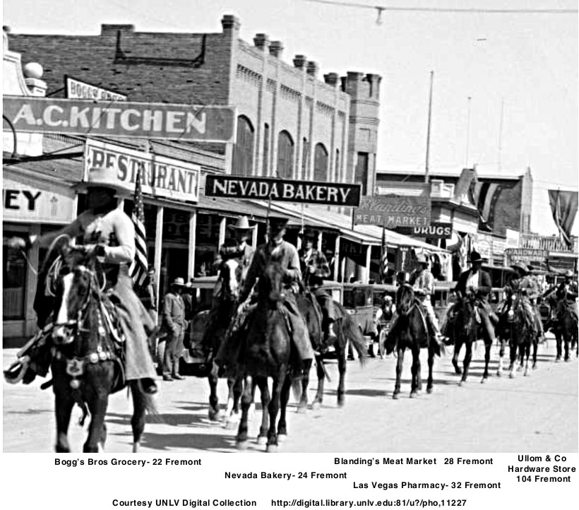 1930’s Labor Day parade showing Chop Suey restaurant  A. C. Kitchen  Bogg’s Bros Grocery   Nevada Bakery    Blanding’s Meat Market  Las Vegas Pharmacy   Ullom & Co Hardware Store  